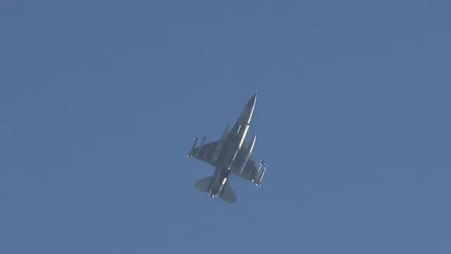 epa11718406 An Israeli F-16 fighter jet flies as an alarm for hostile aircraft (UAV) fire from Lebanon sounds above the city of Kiryat Yam, north of Haifa, Israel, 13 November 2024. According to the Israeli army, two UAVs were intercepted over Israeli territory. No injuries were reported. EPA/ABIR SULTAN