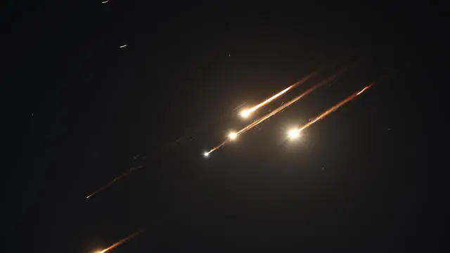 epa12173749 Missiles launched from Iran as seen over Jerusalem, 13 June 2025. Israelâ€™s military has identified missiles being launched from Iran towards the territory of Israel in retaliation following overnight airstrikes on Iranian targets. EPA/ATEF SAFADI