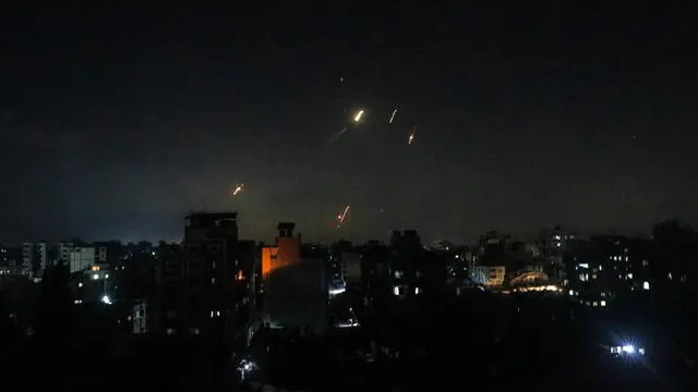 epa12173895 Iranian missiles pass through the airspace of the Gaza Strip before striking targets inside Israel, 13 June 2025. Israel's military has identified missiles being launched from Iran towards the territory of Israel in retaliation following overnight airstrikes on Iranian targets. EPA/MOHAMMED SABER