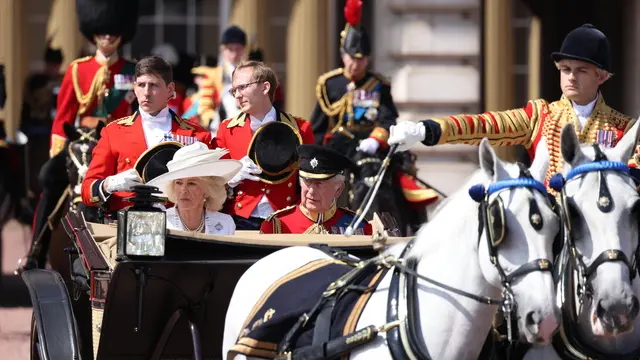 epa12174809 Britain’s King Charles III (R) and Queen Camilla (L) ride in a carriage during the Trooping the Colour ceremony in London, Britain, 14 June 2025. The King's birthday parade, traditionally known as Trooping the Colour, is a ceremonial military parade to celebrate the official birthday of the British sovereign. EPA/NEIL HALL