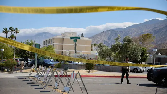 epa12111435 A police officer closes off a street after an explosion outside the American Reproductive Centers office, in Palm Springs, California, USA, 17 May 2025. At least one person is dead and multiple were injured in an explosion outside a Palm Springs, CA fertility clinic, which Palm Springs Police called an 'intentional act of violence'. EPA/ALLISON DINNER