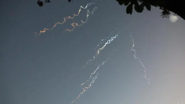 epa12174475 Smoke trails from ballistic missiles in the sky above Jerusalem, Israel, 14 June 2025. An Israeli Defense Forces (IDF) spokesperson said Iran launched a wave of ballistic missiles toward Israel, and according to emergency service Magen David Adom (MDA), 41 people were injured, including two in critical condition. EPA/ABIR SULTAN