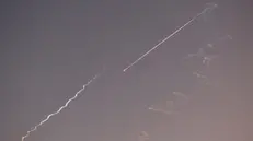 epa12174476 Ballistic missiles and smoke trails from ballistic missiles in the sky above Jerusalem, Israel, 14 June 2025. An Israeli Defense Forces (IDF) spokesperson said Iran launched a wave of ballistic missiles toward Israel, and according to emergency service Magen David Adom (MDA), 41 people were injured, including two in critical condition. EPA/ABIR SULTAN