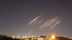 epa12175801 A slow exposure picture shows ballistic missiles above Jerusalem, 14 June 2025. Israel's military has identified missiles being launched from Iran towards the territory of Israel in retaliation following overnight airstrikes on Iranian targets. EPA/ABIR SULTAN