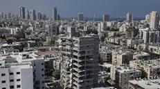 epaselect epa12176727 Damaged residential buildings after Iranian ballistic missiles hit Bat Yam, central Israel, 15 June 2025. Iran launched a barrage of ballistic missiles at Israel overnight in retaliation for Israeli airstrikes on Iranian targets. Magen David Adom (MDA), Israel's national emergency services, reported at least six killed and dozens injured, including two in critical condition. Israeli army home front command are still looking for dozens of missing people under the rubble EPA/ABIR SULTAN