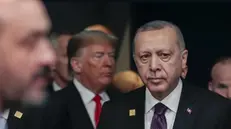 epa08043531 Turkey President Recep Tayyip Erdogan and US President Donald Trump (back) during NATO Summit in London, Britain, 04 December 2019. NATO countries' heads of states and governments gather in London for a two-day meeting. EPA/OLIVIER HOSLET