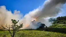 epa12153189 Ukrainian servicemen fire a self-propelled multiple rocket system towards a Russian position on the frontline in the Donetsk region, Ukraine, 03 June 2025, amid the ongoing Russian invasion. EPA/SERGEY KOZLOV