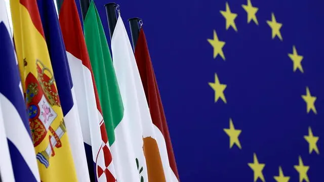 epa12002479 European flags and the EU flag in the plenary chamber at the European Parliament in Strasbourg, France, 01 April 2025. The EU Parliament's session runs from 31 March to 03 April 2025. EPA/RONALD WITTEK