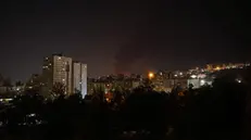 epa12176029 Smoke rises from an oil warehouse in Tehran, Iran, 15 June 2024. Israel continues its strikes on Iran's nuclear program and energy facilities. EPA/ABEDIN TAHERKENAREH