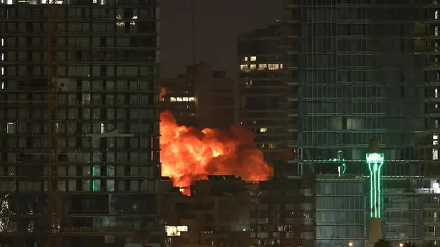 epa12178187 An explosion erupts from a missile fired from Iran in Tel Aviv, Israel, 16 June 2025. Israel and Iran have been exchanging fire since Israel attacked on 13 June 2025 as part of Operation 'Rising Lion.' EPA/ATEF SAFADI