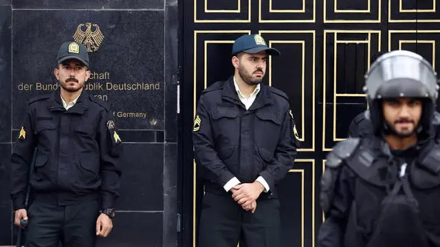 epa10278472 Iranian anti-riot police forces keep watch as protesters gather in front of the German embassy in Tehran, Iran, 01 November 2022. Iranian protesters condemned what they claim to be 'Germany's support of anti-government protests in Iran' as well as holding massive anti-Iran rally by Iranian oppositions earlier in Berlin. Iran has been facing anti-government protests whole over the world for more than a month. EPA/ABEDIN TAHERKENAREH