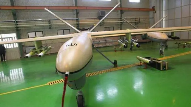 epa03886367 A handout picture provided by the Iranian Defense Ministry, shows Iranian long-range drone, Shahed129 (witness 129) during a ceremony in Tehran, Iran, 27 September 2013. Iranian revolutionary guards have unveiled a new fight drone on 27 September 2013. The Shahed-129 (witness 129) can fly up to 1700 kilometers. According to the reports the drone can carry eight rockets used for military as well as scientific purposes. EPA/SEPAH NEWS/HANDOUT HANDOUT EDITORIAL USE ONLY/NO SALES
