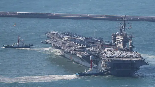 epa10554993 The US Navy's nuclear-powered aircraft carrier USS Nimitz sets sail from a naval base in Busan, South Korea, 02 April 2023. EPA/YONHAP SOUTH KOREA OUT