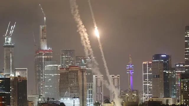 epaselect epa12176279 Israel's Iron Dome air defense system intercepts ballistic missiles fired from Iran over the city of Tel Aviv, Israel, 15 June 2025. Israel's military identified the missiles as being launched from Iran toward Israeli territory in retaliation for overnight airstrikes on Iranian targets. EPA/ATEF SAFADI