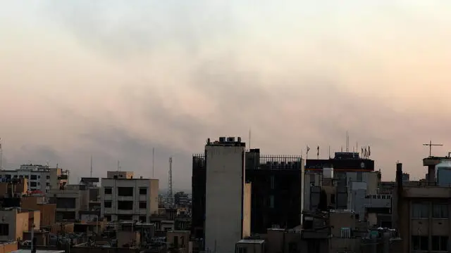 epa12179412 Smoke rises on the horizon following an Israesli airstrike north of Tehran, Iran, 16 June 2025. Israel targeted Iran's State Television (IRIB) and sites related to Iran's nuclear program and energy facilities. Israel and Iran have been exchanging fire since Israel launched strikes across Iran on 13 June 2025. EPA/ABEDIN TAHERKENAREH