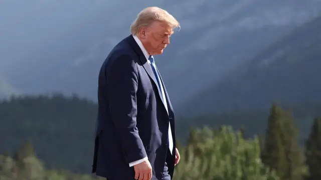 epaselect epa12180147 US President Donald Trump departs after a family photo during the Group of Seven (G7) Summit at the Kananaskis Country Golf Course in Kananaskis, Alberta, Canada, 16 June 2025. World leaders are gathered from 15 to 17 June 2025 for the annual G7 Summit. EPA/SUZANNE PLUNKETT / POOL