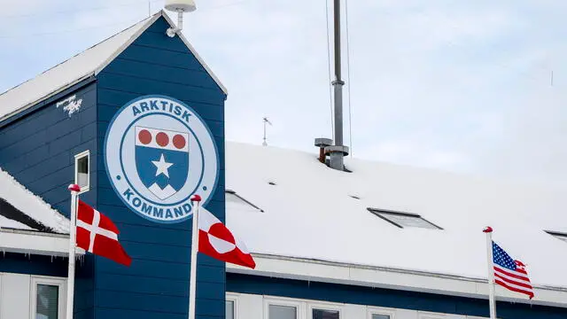 epa11964690 A Danish flag (L) and a US flag (R) fly outside the Arctic Command building in Nuuk, Greenland, 14 March 2025. Arctic Command handles the defense's tasks in and around Greenland and the Faroe Islands. EPA/MADS CLAUS RASMUSSEN DENMARK OUT