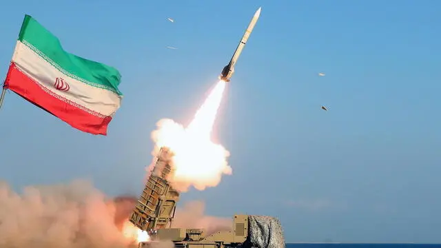 epa10383634 A handout photo made available by the Iranian Army Office shows Iranian Army troops fire a missile during a military drill in Makran beach, Gulf of Oman, near the Strait of Hormuz, southern of Iran, 31 December 2022. EPA/IRANIAN ARMY OFFICE HANDOUT HANDOUT EDITORIAL USE ONLY/NO SALES