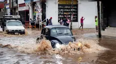 epa12186539 Vehicles travel through a flooded street in JuchitÃ¡n, Mexico, 19 June 2025. Hurricane Erick, the first of the 2025 season in the Mexican Pacific, made landfall as a Category 3 hurricane and weakened to a tropical storm after passing through the state of Guerrero, in southern Mexico, causing material damage but no casualties. EPA/LUIS VILLALOBOS
