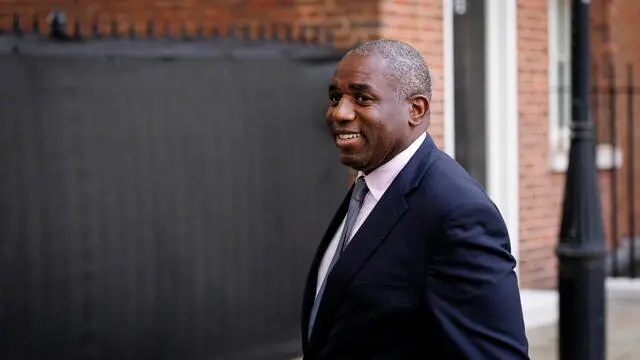 epa12123532 British Foreign Secretary David Lammy leaves 10 Downing Street during a visit by President of Cyprus Nikos Christodoulides (not pictured) in London, Britain, 21 May 2025. EPA/TOLGA AKMEN