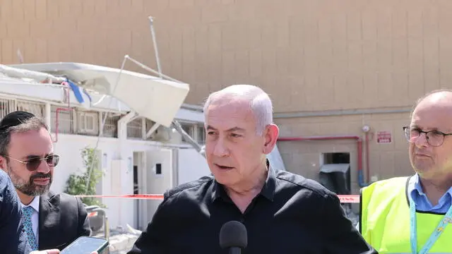 epa12185450 Israeli Prime Minister Benjamin Netanyahu speaks to the press as he visits the Soroka hospital complex, after it was hit by a missile fired from Iran, in Beer Sheva, Israel, 19 June 2025. Israel and Iran have been exchanging fire since Israel launched strikes across Iran on 13 June 2025 as part of Operation 'Rising Lion.' EPA/MARC ISRAEL SELLEM/POOL