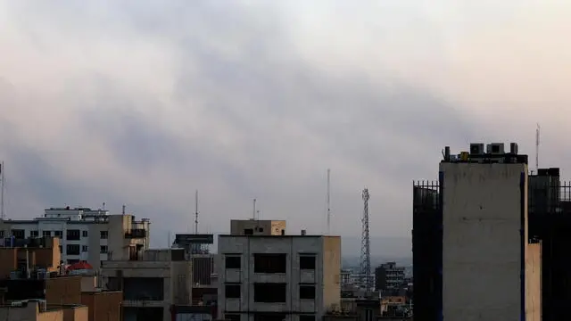 epa12179413 Smoke rises on the horizon following an Israesli airstrike north of Tehran, Iran, 16 June 2025. Israel targeted Iran's State Television (IRIB) and sites related to Iran's nuclear program and energy facilities. Israel and Iran have been exchanging fire since Israel launched strikes across Iran on 13 June 2025. EPA/ABEDIN TAHERKENAREH