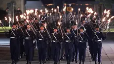 epa12075945 Soldiers of the honor guard march during a military grand tattoo in Berlin, Germany, 05 May 2025. German acting Chancellor Olaf Scholz receives on 05 May 2025 on the occasion of his farewell, a Grand Tattoo of the German Federal Armed Forces (Bundeswehr). EPA/CLEMENS BILAN