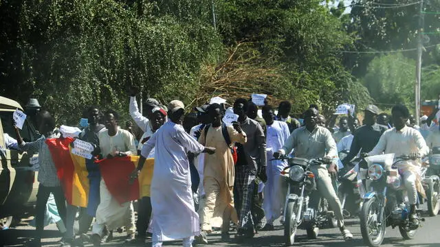epa11760867 Protesters take part in a march against the French military presence in N’Djamena, Chad, 06 December 2024. Several hundred people took to the streets to demand the withdrawal of French troops from the country, a week after Chad ended a military agreement with France. EPA/STR