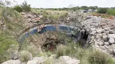 epa11823700 A nearby disused mine shaft shows dangerous nature of the shafts at former commercial mines that are used by illegal miners, during the official rescue operation at a disused gold mine shaft in Stilfontein, around 150 kilometers southwest of Johannesburg, South Africa, 14 January 2025. A South African court has ordered the official rescue attempts to begin as an unknown number of illegal gold miners, or Zama Zama, are trapped underground, of which 10 miners have been rescued. The number of Zama Zama to have died underground has already reached 109 according to an attorney at Lawyers for Human Rights. The miners are armed and form part of a wider syndicate-driven gold mining operation that often uses disused commercial gold mines to search for gold. EPA/KIM LUDBROOK