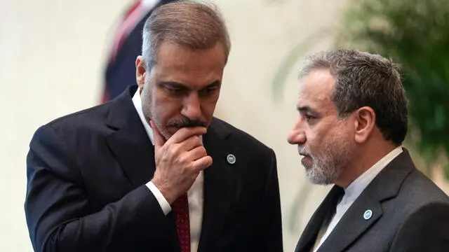 epa12188824 Turkish Foreign Minister Hakan Fidan (L) and Iranian Foreign Minister Abbas Araghchi (R) chat before the opening of the 51st Session of the Organization of Islamic Cooperation (OIC) Council of Foreign Ministers in Istanbul, Turkey, 21 June 2025. The 51st Session of the Session of the OIC Council of Foreign Ministers meeting will be held in Istanbul from 21 to 22 June 2025. EPA/ERDEM SAHIN