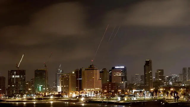 epa12182370 The Iron Dome, the Israeli air defense system, intercepts missiles fired from Iran, over Tel Aviv, Israel, 18 June 2025. Israel and Iran have been exchanging fire since Israel attacked Iran on 13 June 2025 as part of operation 'Rising Lion'. EPA/ATEF SAFADI