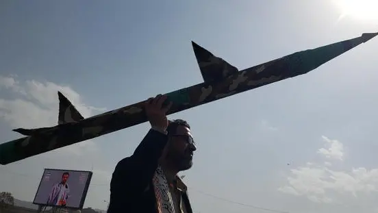 epa12187411 A Houthi supporter holds up a mock missile during a protest against the Israeli airstrikes on Iran, in Sana'a, Yemen, 20 June 2025. Thousands of Houthi supporters demonstrated in Sana'a in solidarity with the Iranian people amid the recent military escalation between Israel and Iran. Houthi leader Abdul-Malik al-Houthi has pledged, in a televised speech, full support for Iran and Gaza in response to the Israeli military operations, vowing that his group’s missile attacks against Israel, including maritime actions, would continue. EPA/YAHYA ARHAB