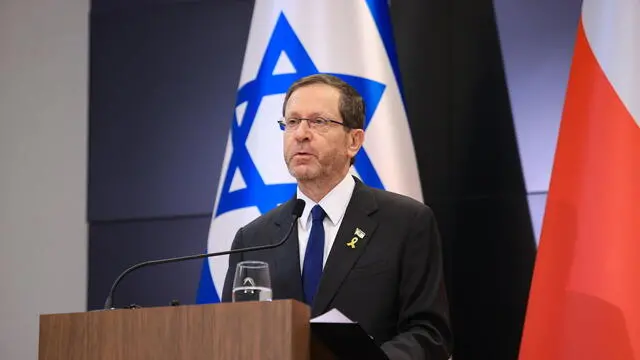 epa12050820 Israeli President Isaac Herzog attends a press conference with the Polish President Andrzej Duda (not pictured) at the International Center for Education about Auschwitz and the Holocaust before the 'March of the Living', in Oswiecim, southern Poland, 24 April 2025. The annual Holocaust-commemorating 'March of the Living' occurs at the site of the wartime German Nazi death camp Auschwitz-Birkenau and has been held since 1988 to honor Holocaust Remembrance Day. EPA/JAREK PRASZKIEWICZ POLAND OUT