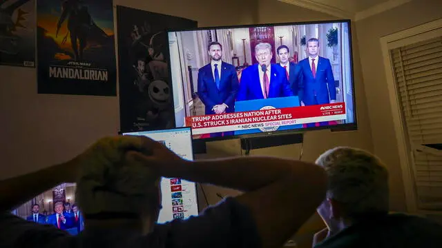 epa12190348 Young people watch US President Donald Trump address the nation following the U.S. attack on Iran's nuclear sites, in Miami, Florida, USA, 22 June 2025. President Trump stated that the Fordow enrichment facility was obliterated by U.S. airstrikes. EPA/CRISTOBAL HERRERA-ULASHKEVICH