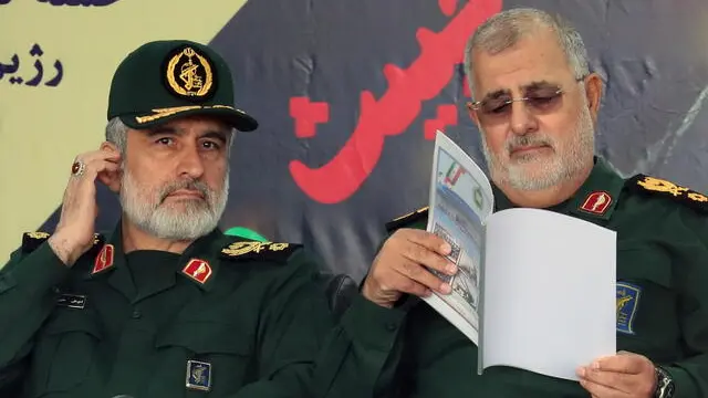 epa11283997 Iranian commander of the Islamic Revolutionary Guard Corps' Aerospace Force Amir Ali Hajizadeh (L), Brigadier-General and Commander of Iran's Islamic Revolutionary Guard Corps Mohammad Pakpour (R) attend the annual Army Day celebration at a military base in Tehran, Iran, 17 April 2024. According to Iranian state media, Raisi described the recent attack launched towards Israel as 'limited' and 'punitive', adding that any act of aggression against Iran will be dealt with a 'powerful and fierce' response. Iran's Islamic Revolutionary Guards Corps (IRGC) launched drones and rockets towards Israel late on 13 April. EPA/ABEDIN TAHERKENAREH