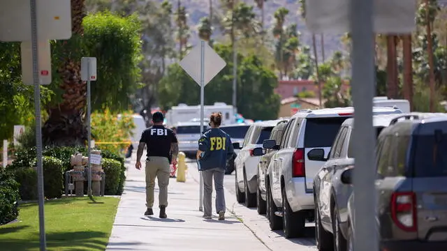epa12111438 FBI agents walk down the street following an explosion outside the American Reproductive Centers office, in Palm Springs, California, USA, 17 May 2025. At least one person is dead and multiple were injured in an explosion outside a Palm Springs, CA fertility clinic, which Palm Springs Police called an 'intentional act of violence'. EPA/ALLISON DINNER