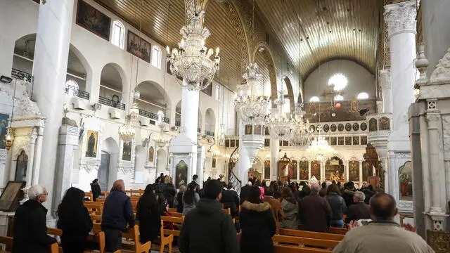 epa11789506 Syrian Christians attend a mass at the Mariamite Cathedral of Damascus before the Christmas holiday in the old city of Damascus, Syria, 22 December 2024, following the ouster of president Bashar al-Assad. The Mariamite cathedral is one of the oldest churches in Damascus. EPA/MOHAMMED AL RIFAI