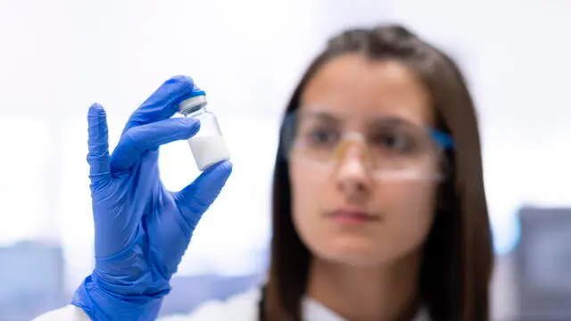epa10550914 An employee works at the headquarters of the pharmaceutical company Hipra in the town of Amer (Girona province, Catalonia region, northeastern Spain), 30 March 2023. Hipra has presented the Bimervax vaccine against covid-19 after the Committee for Medicinal Products for Human Use of the European Medicines Agency (EMA) has recommended its approval. A total of fourteen countries have already shown an interest in the named vaccine. EPA/David Borrat