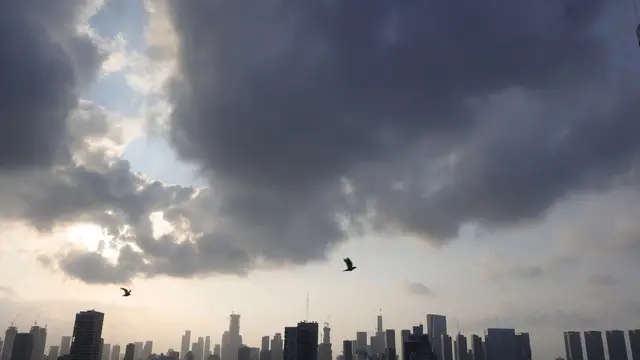 epa12192288 Birds fly at sunrise above the Tel Aviv skyline amid the Iranian ballistic missile threat in Tel Aviv, Israel, 23 June 2025. Israel and Iran have been exchanging fire since Israel attacked Iran on 13 June 2025 as part of operation 'Rising Lion'. EPA/ABIR SULTAN