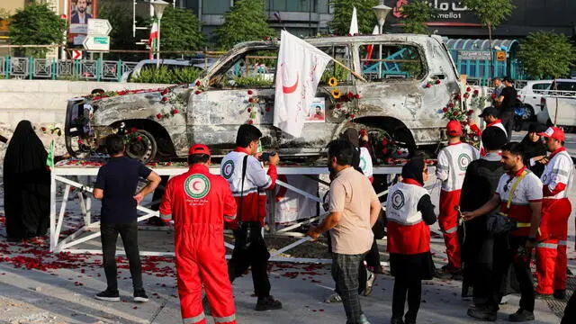 epa12192265 A handout picture provided by the Iranian Red Crescent Society (IRSC) shows members of the organisation placing flowers and petals on the Red Crescent vehicle which was attacked during the Israeli air strike on 19 June, in Tehran, Iran, 23 June 2025. US forces struck three of Iran's key nuclear sites: Natanz, Isfahan and Fordo, US President Trump announced on 21 June. Israel and Iran have been exchanging fire since Israel launched strikes across Iran on 13 June 2025 as part of Operation 'Rising Lion.' EPA/HANDOUT HANDOUT EDITORIAL USE ONLY/NO SALES