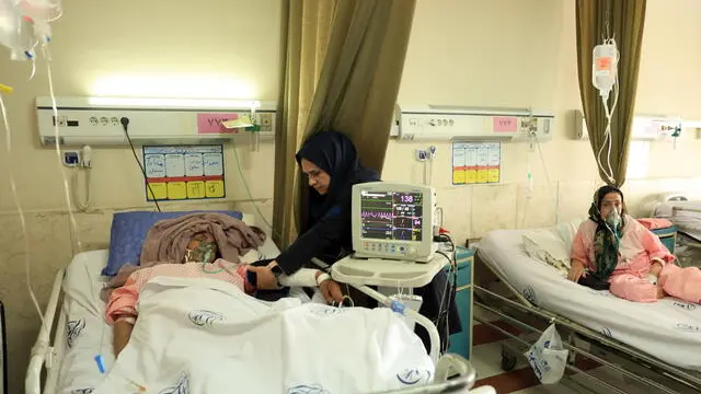 epa12188969 An Iranian woman is hospitalized at the Rasoul Akram hospital after Israeli airstrikes in Tehran, Iran, 21 June 2025. According to the Iranian Health Ministry, more than 600 military staff and civilians have been killed and more than 2,000 people have been injured following Israel's attack on Iran. Israel and Iran have been exchanging fire since Israel launched strikes across Iran on 13 June 2025 as part of Operation 'Rising Lion.' EPA/ABEDIN TAHERKENAREH
