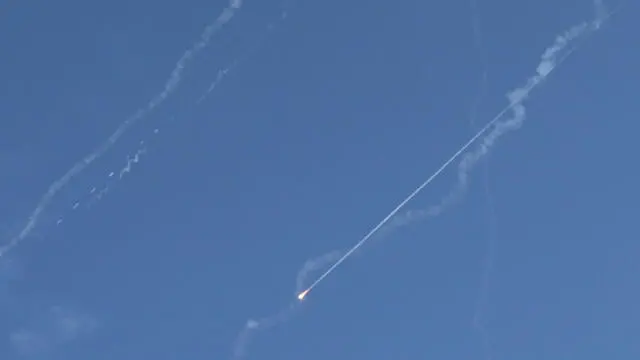 epa12190422 Israel's anti-missile defense tries to intercept a Ballistic missile seen above Jerusalem, Israel, 22 June 2025. EPA/ABIR SULTAN EPA