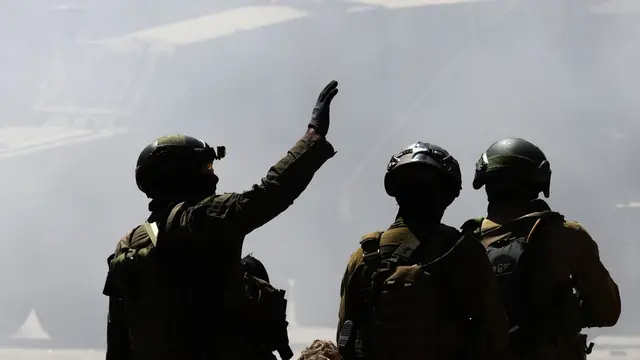 epa12183492 Israeli soldiers check the area after demolishing a store with explosives during a military operation in the Balata refugee camp, near the West Bank city of Nablus, 18 June 2025. According to the Palestinian Health Ministry, at least 20 Palestinians were wounded during the operation. EPA/ALAA BADARNEH