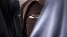 epa08219488 Demonstrators with face-covering clothing take part in a protest against the niqab ban, in The Hague, the Netherlands, 15 February 2020. The Dutch government prohibits clothing that completely covers the face at certain locations: in public transport, education, care and government buildings. EPA/REMKO DE WAAL