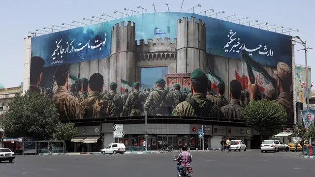 epa12194167 An anti-Israeli billboard reading in Persian 'Now is our turn' in Tehran, Iran, 24 June 2025. Israel's military on 24 June, accused Iran of violating a ceasefire by launching missiles into Israeli airspace. Iran's General Staff of the Armed Forces Abdolrahim Mousavi denied firing any missiles towards Israel, Iranian state media reported. EPA/ABEDIN TAHERKENAREH