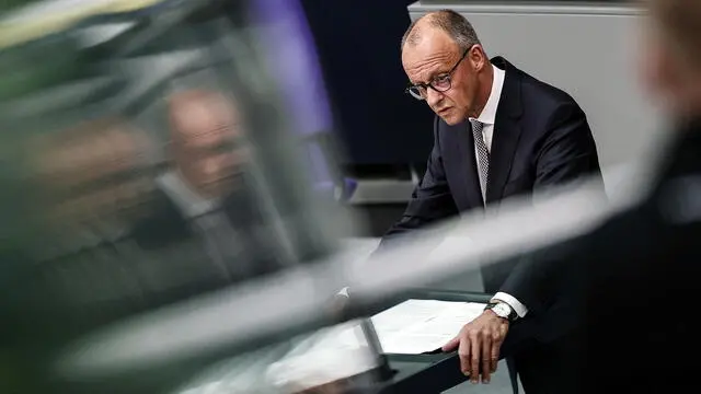 epa12194308 German Chancellor Friedrich Merz delivers a government statement during a session of the German parliament Bundestag in Berlin, Germany, 24 June 2025. German Chancellor Merz is making his statement on the forthcoming summits of the European Union and NATO. EPA/FILIP SINGER