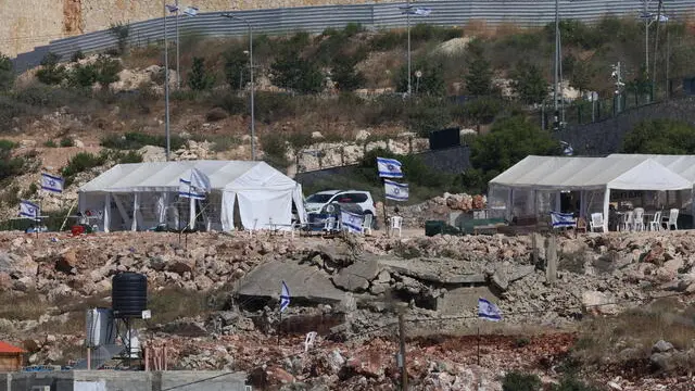 epa12127497 Tents set up by Israeli settlers near the West Bank village of Bruqin, west of Salfit, 23 May 2025. The Palestinian news agency Wafa reported that Israeli bulldozers have been levelling vast stretches of lands on the outskirts of Bruqin and Kafr ad-Dik villages. The land clearing is aimed at constructing roads and spaces to serve Israeli settlers. EPA/ALAA BADARNEH