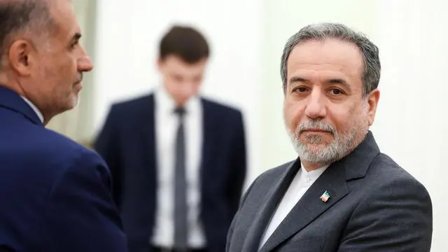 epa12192615 Iranian Foreign Minister Abbas Araghchi (R) and Iranian Ambassador to Russia Kazem Jalali (L) attend a meeting with the Russian president at the Kremlin in Moscow, Russia, 23 June 2025. EPA/ALEXANDER KAZAKOV / SPUTNIK / KREMLIN POOL