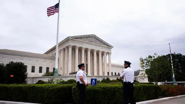 epa09441145 United States Supreme Court police stand outside the Supreme Court in Washington, DC, USA, 01 September 2021. The United States Supreme Court declined to take action in response to an emergency appeal by Texas abortion providers, allowing a Texas law to begin that bans abortions as early as six weeks into pregnancy. The Texas law is one of the most restrictive abortion laws in the nation. EPA/MICHAEL REYNOLDS