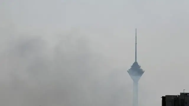 epa12183875 Smoke rises near the Milad Tower following an Israeli airstrike on Tehran, Iran, 18 June 2025. Israel and Iran have been exchanging fire since Israel launched strikes across Iran on 13 June 2025 as part of Operation 'Rising Lion.' EPA/ABEDIN TAHERKENAREH
